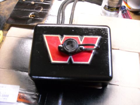 1992 Jeep Wrangler - A black control box with a red and white 'W' logo is shown. The control box has two cables extending from the top and a circular button wit…