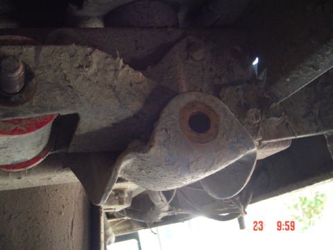 1989 Ford Bronco - Underside view of a vehicle's suspension part, showing wear and tear.