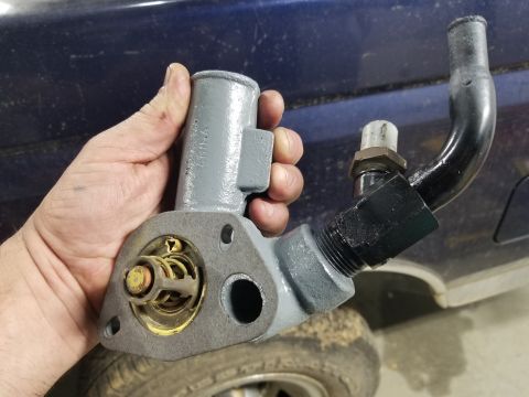 1995 Ford F-150 - The old t'stat seems to have been working, so I'm reusing it. It's not difficult or expensive to swap when it fails. The gasket is the same…