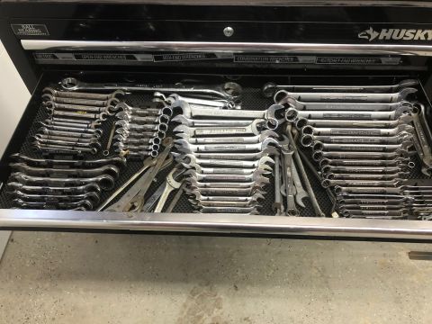 1992 Jeep Wrangler - A top-down view of an open toolbox drawer filled with various wrenches and pliers.