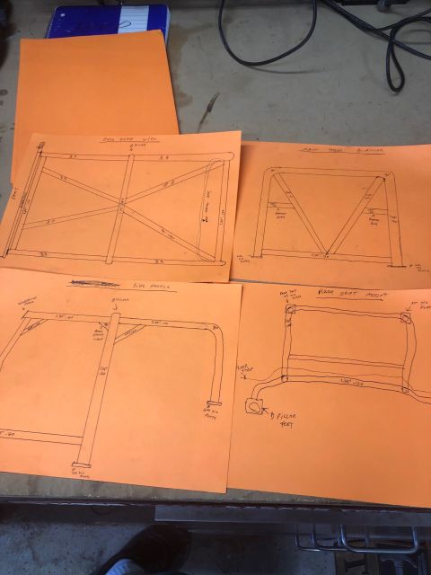 1992 Jeep Wrangler - Four orange sheets of paper with hand-drawn technical diagrams and measurements for a vehicle roll cage. The diagrams include overhead, sid…