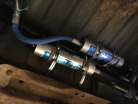 1987 Ford Bronco - Rear shock reservoirs mounted to the upper shock mount. Can't see the crappy foam tape unless you crawl under the truck. Wallered out some…