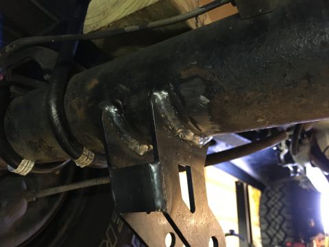 1987 Ford Bronco - Cut the old lower shock mounts off and installed these.