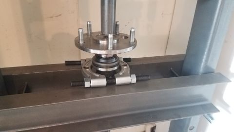 1985 Ford Bronco - A bearing separator tool is used with a press to remove a wheel bearing assembly from a vehicle's hub. The hub has five wheel studs and is…