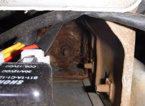 1992 Ford Bronco - Looking down at the front right body mount, between the battery tray and core support. I'm not sure what caused it, but that's definitely t…