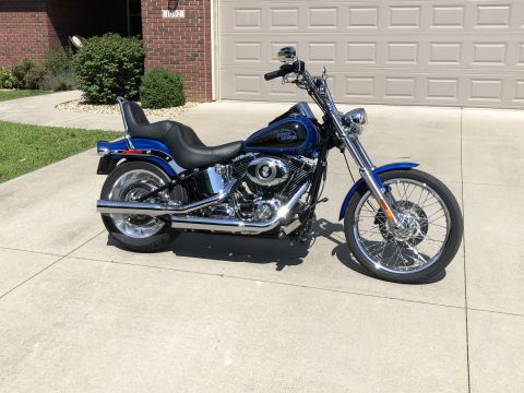 2008 Harley-Davidson Softail - Blue 2008 Harley-Davidson Softail motorcycle with chrome accents parked on a driveway.