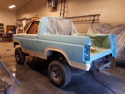 1996 Ford Bronco - This Ford Bronco, likely from the 1980s, is in a workshop being prepped for paint.