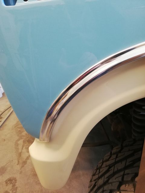 1996 Ford Bronco - Detail shot of a vehicle's fender and wheel well area, showing bodywork and trim.
