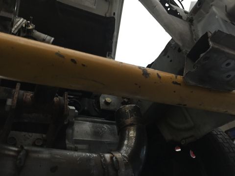 1993 Mercury Tracer - Close-up of a vehicle's undercarriage, showing structural components and exhaust system.