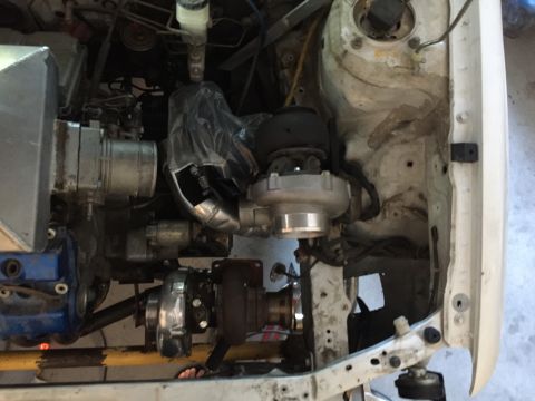 1993 Mercury Tracer - Custom engine bay modifications twin turbochargers and associated piping, likely for performance enhancement.