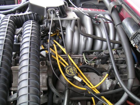 1994 Ford Bronco - Close-up view of an engine bay, showing various components and wiring.
