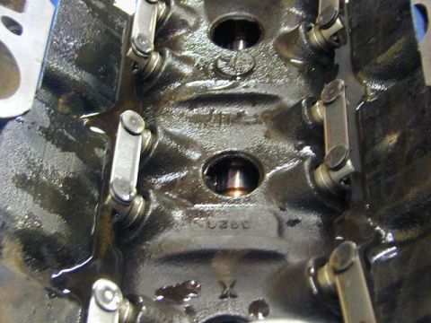 1979 Ford Bronco - This is a close-up view of an engine's internal components, showing rocker arms and oil within the cylinder head.