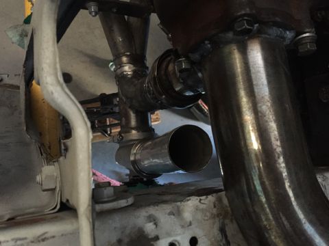 1993 Mercury Tracer - Close-up view of custom exhaust piping, showing welded joints and a muffler connection.