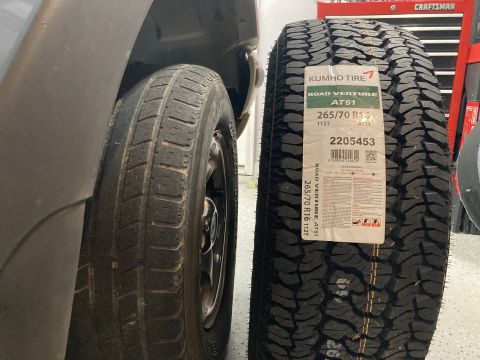 1998 Ford Ranger - A close-up of a tire with a tag attached. The registry claims it is from a 1998 Ford Ranger, but this cannot be confirmed from the image.
