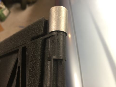 1998 Ford Ranger - Close-up of a damaged HVAC part, showing a crack in the plastic near a metal fitting.