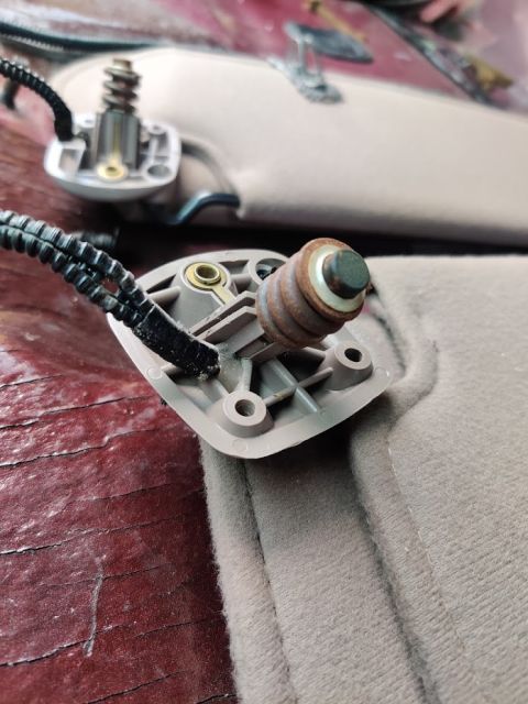 1996 Ford Bronco - 20200719 - You can see the bit that notches into the roof and the spring assembly that goes into the big hole.