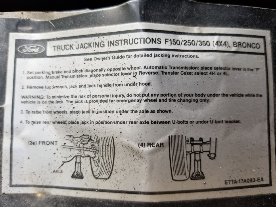 Ford truck jacking-instructions label with numbered steps and front and rear jack-placement figures