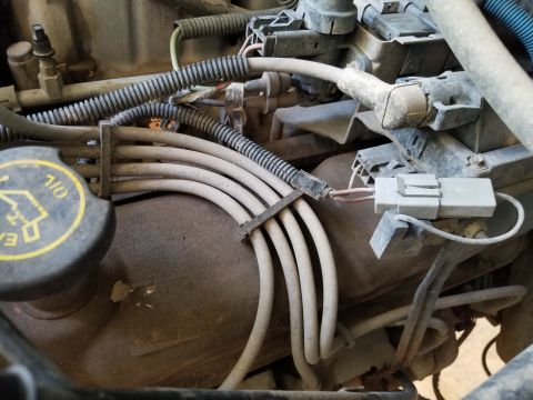 1996 Ford Bronco - Engine code label is too dirty to read; almost too much to see. After rinsing the dirt off, the printing is gone.