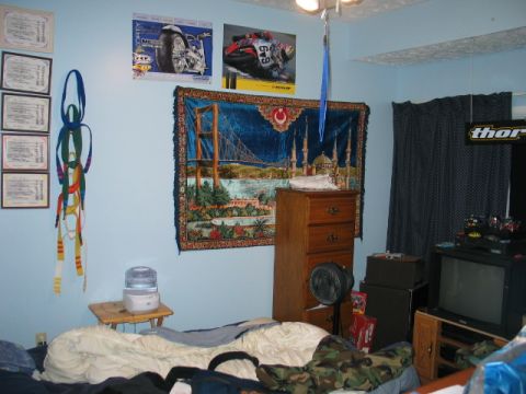 1995 Ford Bronco - Bedroom scene motorcycle posters and a tapestry depicting a bridge and mosque.