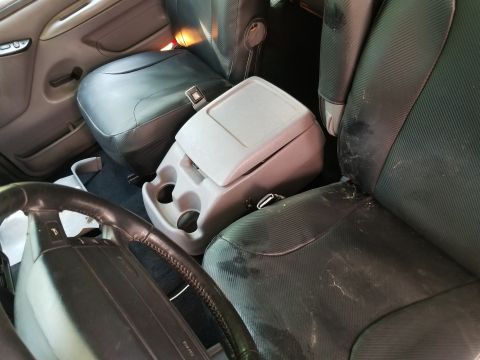 1996 Ford Bronco - The floor console is not attached, and the seat covers are hiding some leather damage. Find console screw holes, cut carpet, install 3 scre…