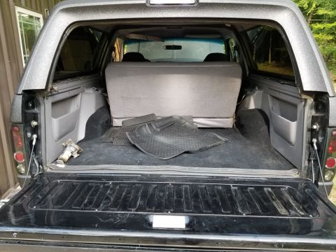 1996 Ford Bronco - Tailgate carpet & outer weatherbelt are missing, and handle mechanism is bent. Add 1-touch window (each window, each direction) $140 [url=h…