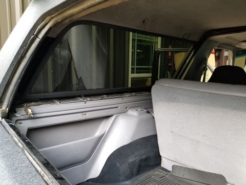 1996 Ford Bronco - There are 2 bolts and the CHMSL connector holding the camper on. The trim is missing. [url=https://www.supermotors.net/registry/media/28249…