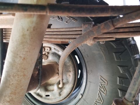 1996 Ford Bronco - The left e-brake cable is slightly kinked at the backing plate. It does not seem to move enough for the e-brake to work OR RELEASE reliably.