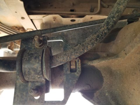 1996 Ford Bronco - The plug welds on the rear axle appear to be weeping. And the sway bar bracket is out-of-place. IF THE IMAGE IS TOO SMALL, click it.