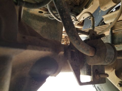 1996 Ford Bronco - The plug welds on the rear axle appear to be weeping. And the sway bar bracket is out-of-place. IF THE IMAGE IS TOO SMALL, click it. [url=h…