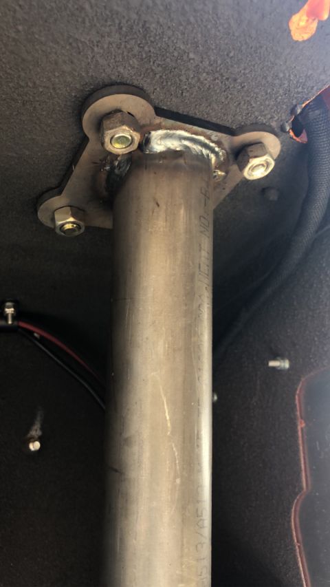 1992 Jeep Wrangler - Close-up of a roll cage mounting bracket and tubing, with visible text on the tube.