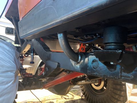 1992 Jeep Wrangler - Custom suspension and frame work visible on the underside of a Jeep Wrangler.