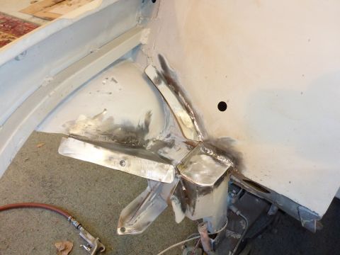 1969 MINI Cooper - Welding and metalwork are being done on a car's chassis, likely during a restoration or repair process.