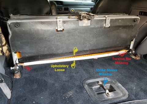 1996 Ford Bronco - The rear seat's upholstery is loose (as usual); the torsion bar is mission; and (as usual), the strike bar's plastic sleeve is missing, all…