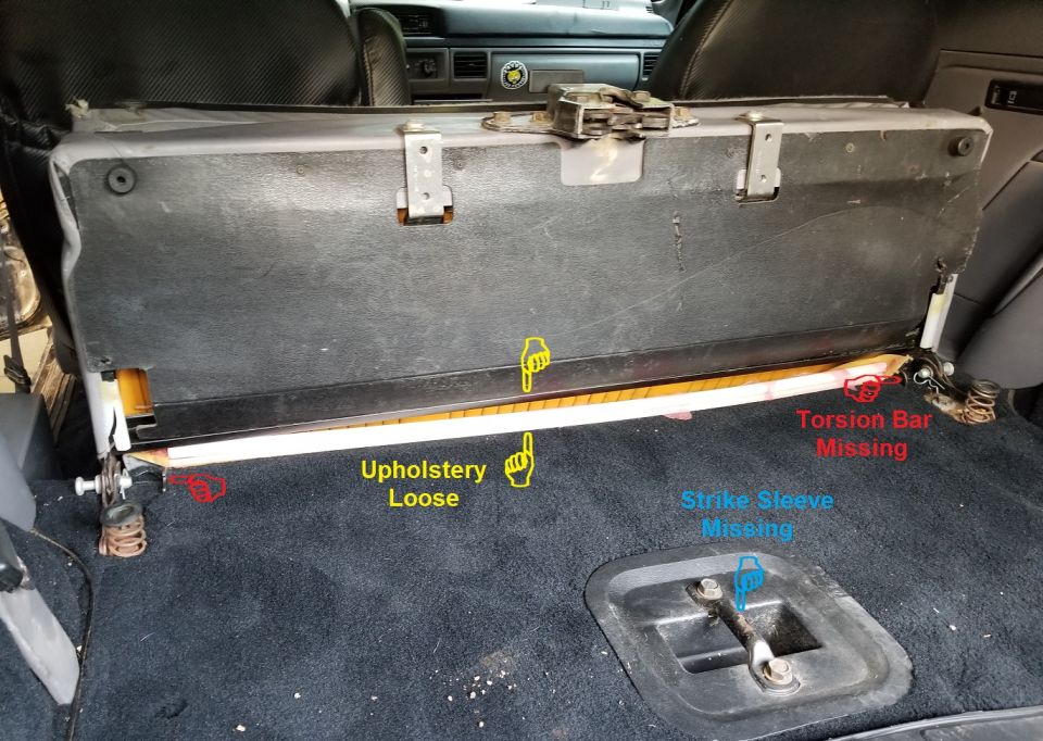 The rear seat's upholstery is loose (as usual); the torsion bar is mission; and (as usual), the strike bar's plastic sleeve is missing, allowing the seat to rattle.

Install & secure rear seat upholstery $40
Supply & install strike sleeve $30 (does not include extracting seized/broken bolts as needed)
Supply & install used OE torsion bar $50