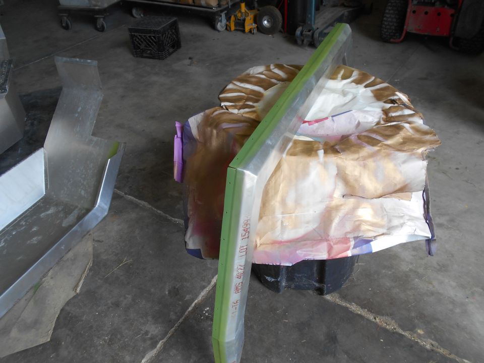 Metal part with green trim and text 'LOT 15498'