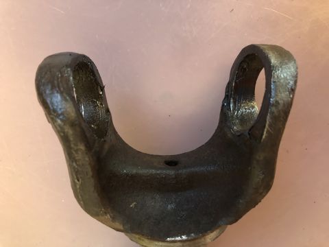 1978 Ford Bronco - A driveshaft U-joint yoke is shown, a critical component for transferring power in a vehicle's drivetrain.