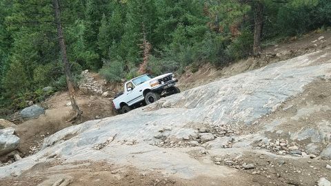 1995 Ford Bronco - This 1995 Ford Bronco navigates a challenging rocky terrain during an off-road excursion.