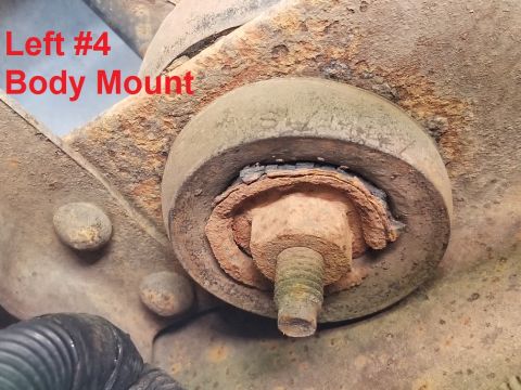 1996 Ford Bronco - This body mount's lower shell is severely rusted, and there's some heavy rust on top of the frame. IF THE IMAGE IS TOO SMALL, click it. R&R…