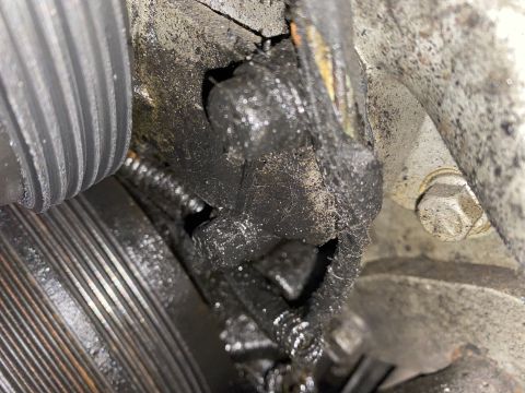 Greasy engine component with oil buildup