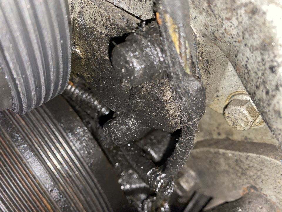 Greasy engine component with oil buildup