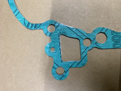 Teal gasket with "200" printed on it.