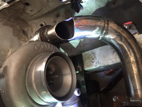 1993 Mercury Tracer - Custom exhaust piping connects to a COMP turbocharger, indicating engine performance upgrades.
