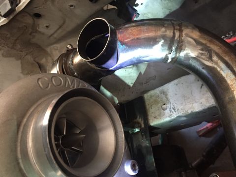 1993 Mercury Tracer - Custom exhaust piping connected to a turbocharger, likely part of an engine modification.