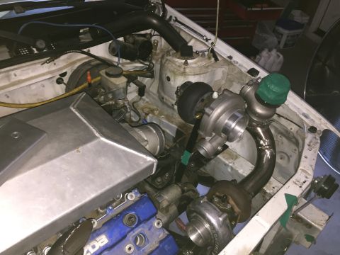 1993 Mercury Tracer - Custom twin turbo setup in an engine bay, showing turbochargers and intake piping.