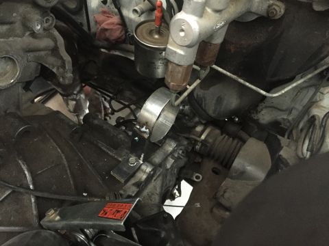 1993 Mercury Tracer - This image shows a close-up view of engine and steering components, including a fuel filter and brake lines.