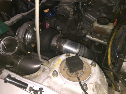 1993 Mercury Tracer - Custom turbo setup in an engine bay, showing modified intake and exhaust components.