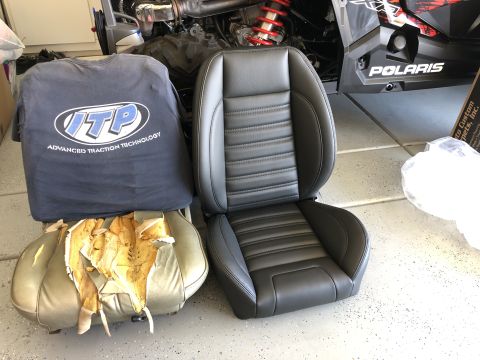 1968 Mercury Cougar - Comparing a new car seat to a damaged one, with a t-shirt nearby.
