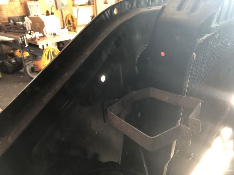 1978 Ford Bronco - A rusty bracket is visible inside the fender well of a vehicle. The registry claims it is a 1978 Ford Bronco, but this is unconfirmed.