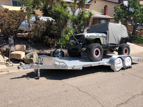 1992 Jeep Wrangler - Modified 1992 Jeep Wrangler loaded onto a trailer for transport.