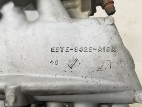 1995 Ford F-150 - Close-up of the cast-aluminum lower intake manifold showing the raised Ford casting number E9TE-9425-A16A along with a "40" and a clock-sty…